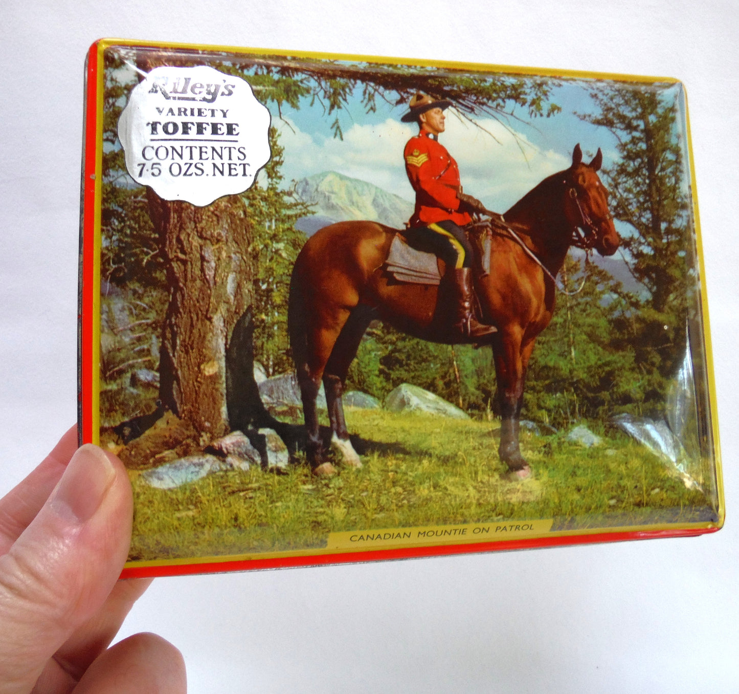 Vintage Tin by Riley's Toffee of Halifax, England: 'CANADIAN MOUNTIE ON PATROL'