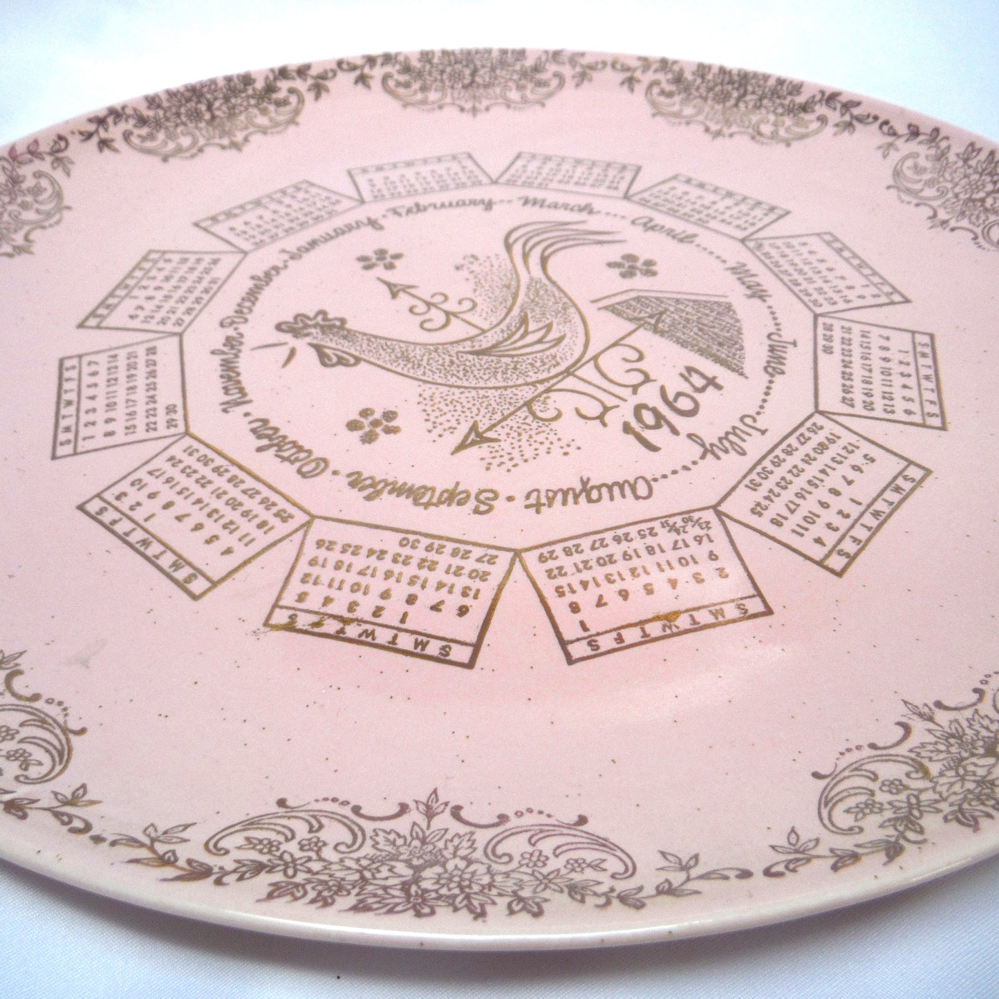 1964 Rare 'Barbie-Like' 10 inch Pink Taylor-Smith-Taylor Pebbleford Calendar Plate from Harburgers Jewelers of Cleveland, Ohio
