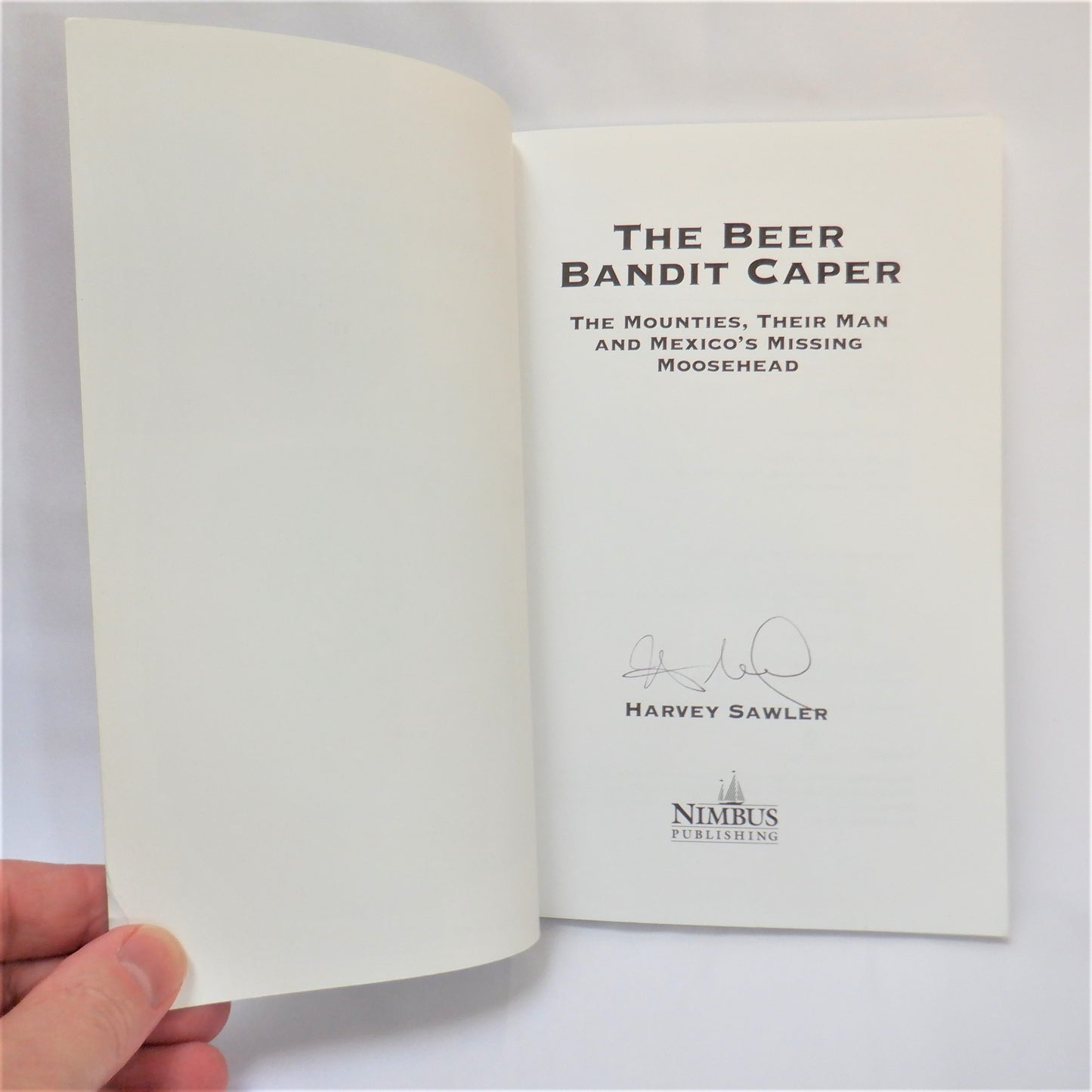 THE BEER BANDIT CAPER; The Mounties, Their Man, and Mexico's Missing Moosehead, by Harvey Sawler (1st Ed. SIGNED)