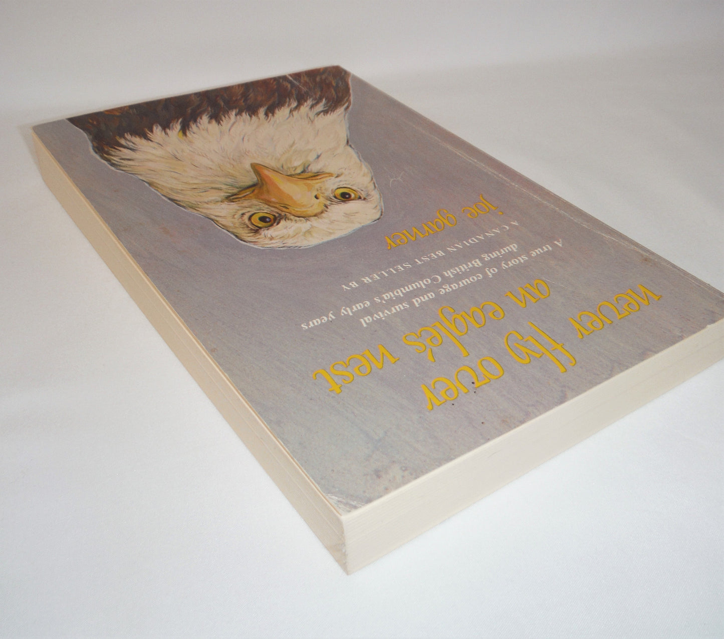 NEVER FLY OVER AN EAGLE'S NEST, A true story of courage and survival during British Columbia's early years, by Joe Garner (1988-SIGNED)