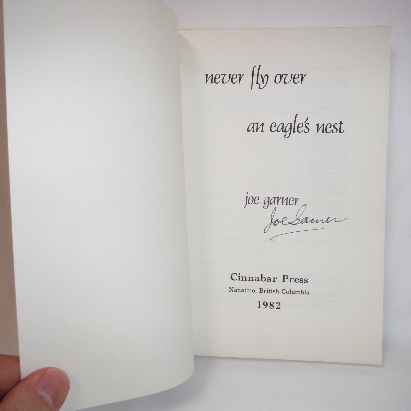 NEVER FLY OVER AN EAGLE'S NEST, A true story of courage and survival during British Columbia's early years, by Joe Garner (1988-SIGNED)