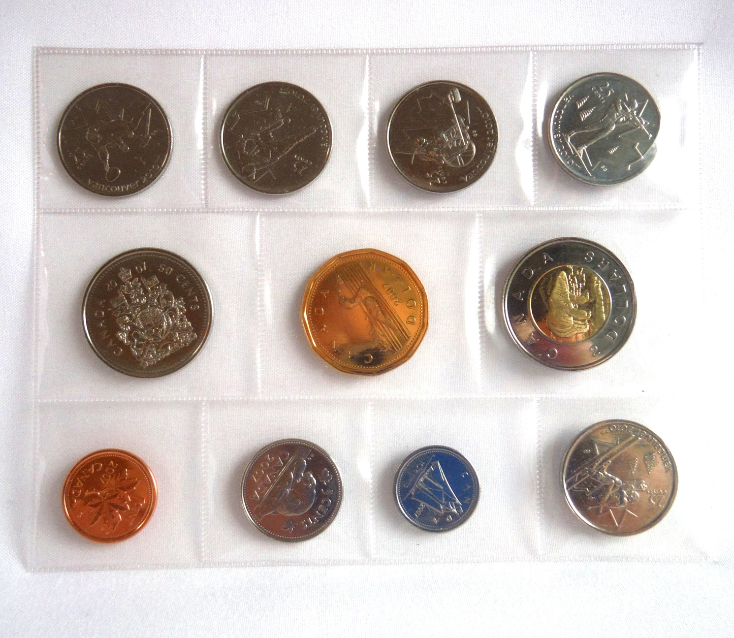 2010 VANCOUVER OLYMPIC WINTER GAMES 11-COIN COLLECTION: Featuring the 2007 7-Coin Annual Collection and 4 2010 Sports Quarters!