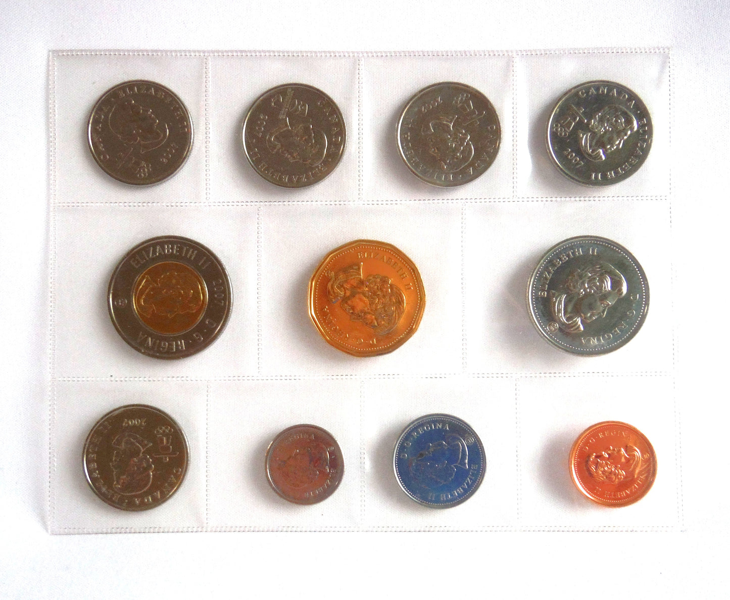 2010 VANCOUVER OLYMPIC WINTER GAMES 11-COIN COLLECTION: Featuring the 2007 7-Coin Annual Collection and 4 2010 Sports Quarters!