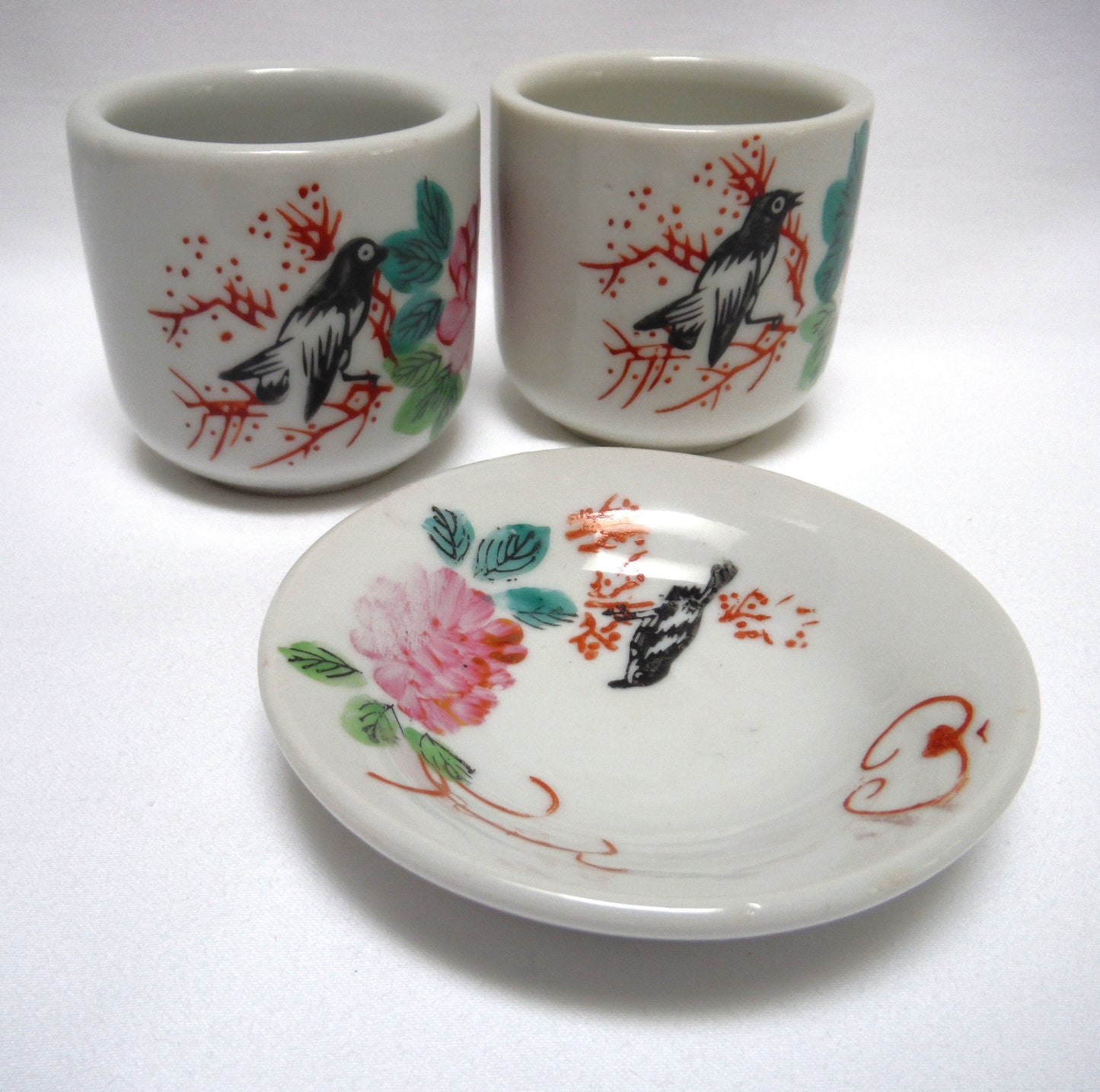 TWO TRADITIONAL CHINESE GREEN-TEA CUPS and ONE SAUCER: In Pink Lotus Flowers with Blackbird and Foliage, distributed by Ming Wo in Vancouver, BC, Canada