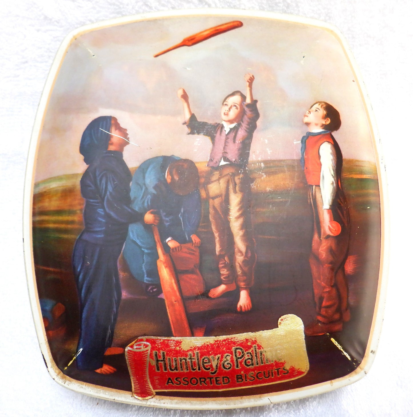 A Famous Antique Biscuit Tin, by HUNTLEY & PALMERS: 'THE CRICKET MATCH TOSS'