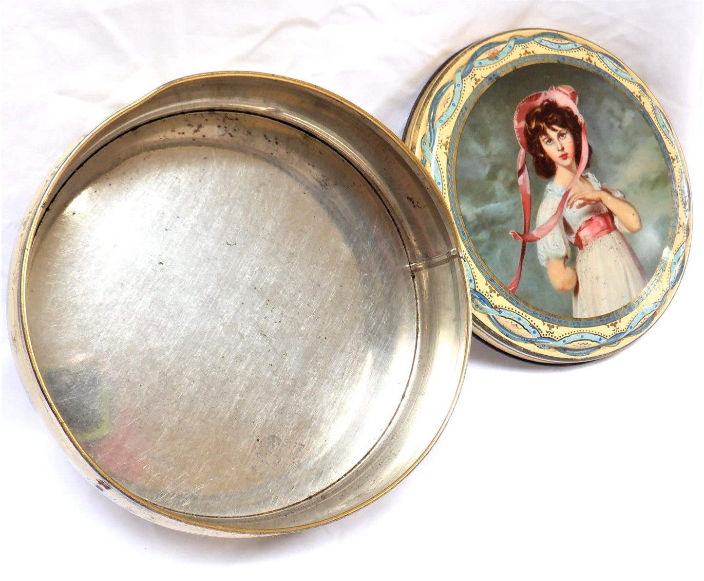 Vintage Tin by PEEK FREAN & COMPANY of London, England: 'Girl in a Pink Bonnet and Sash'