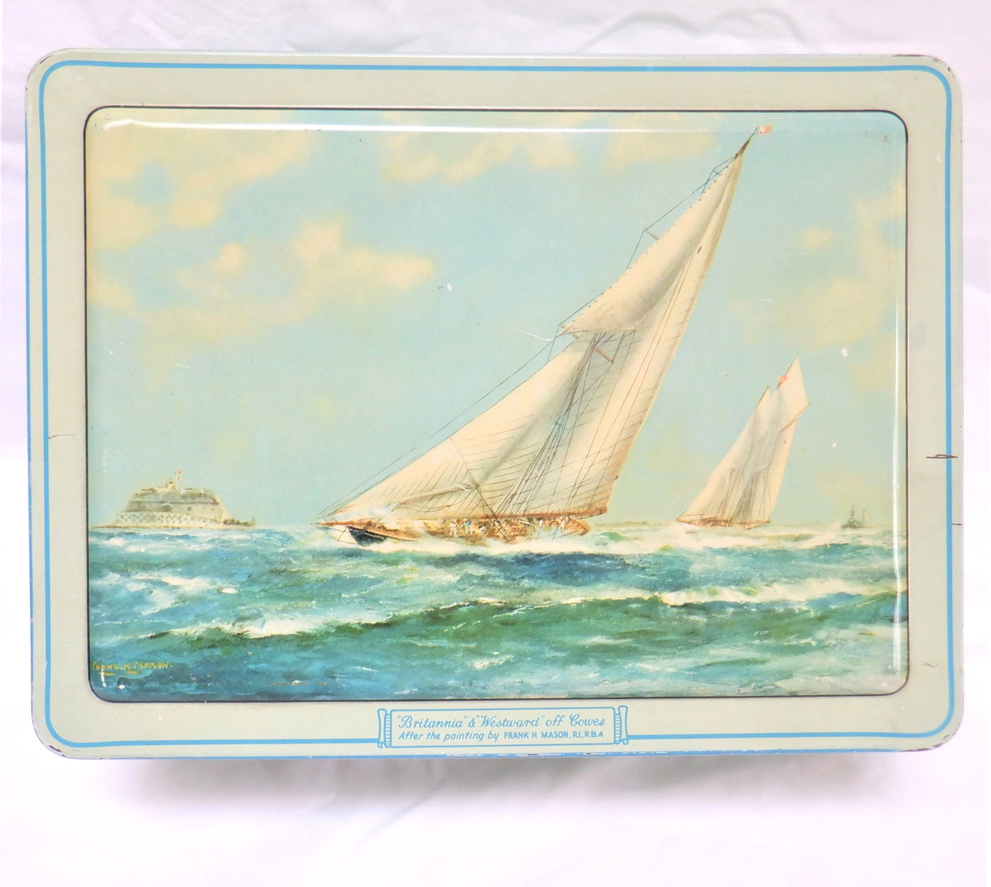 An Antique Milady Confectionery Tin displaying the famous painting by Frank H. Mason: 'BRITANNIA & WESTWARD OFF COWES'