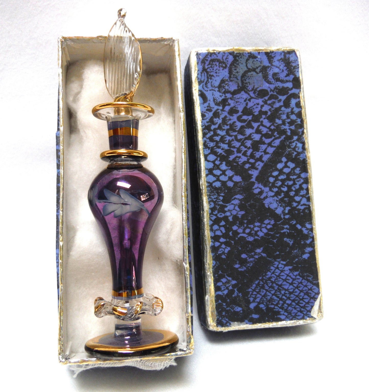 MINIATURE EGYPTIAN PERFUME BOTTLE: 'Nefertitis Tears 18 K gold glided, amethyst toned, mouth blown, hand-cut'