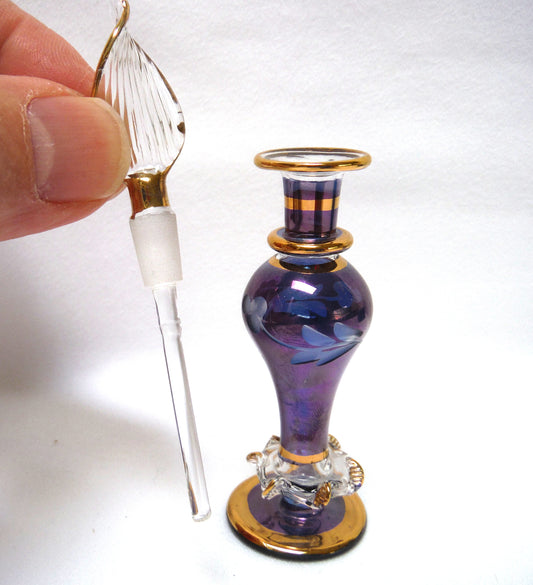 MINIATURE EGYPTIAN PERFUME BOTTLE: 'Nefertitis Tears 18 K gold glided, amethyst toned, mouth blown, hand-cut'
