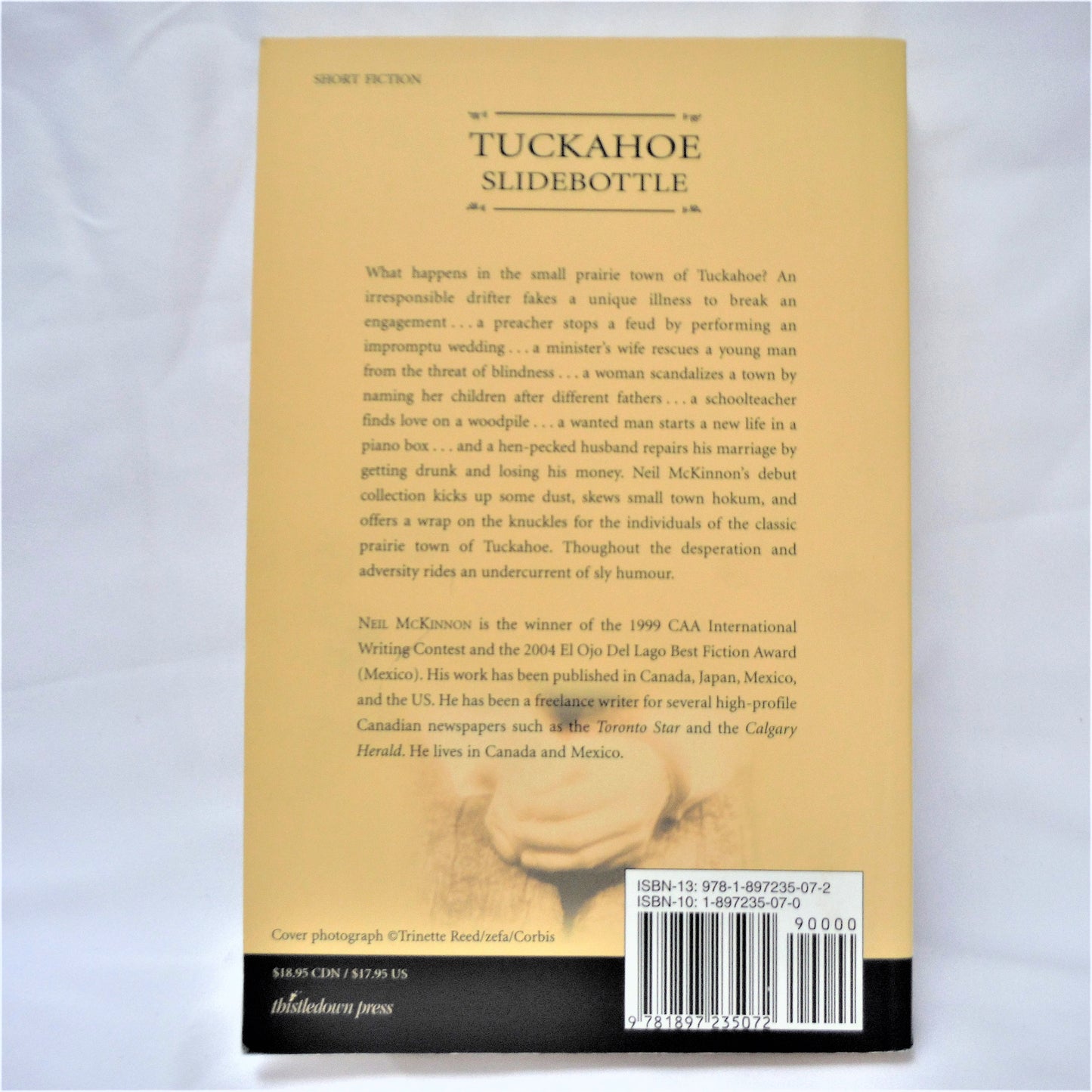 TUCKAHOE SLIDEBOTTLE, Short Stories by Neil McKinnon (1st Ed. SIGNED)