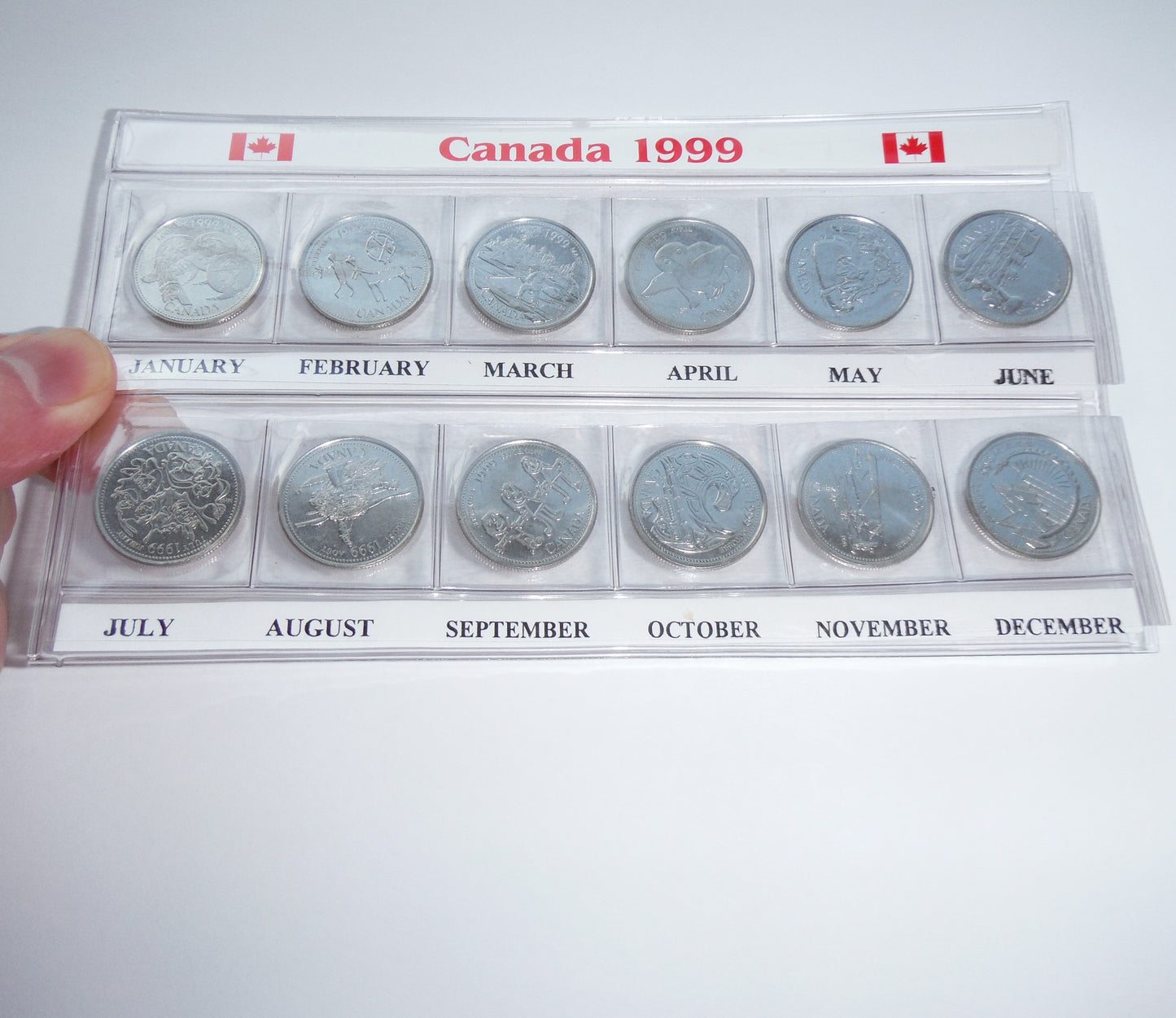 1999 Set of 12 Canadian Millennial 25-Cent Quarters, in Slide-Out Canada Display Pouch