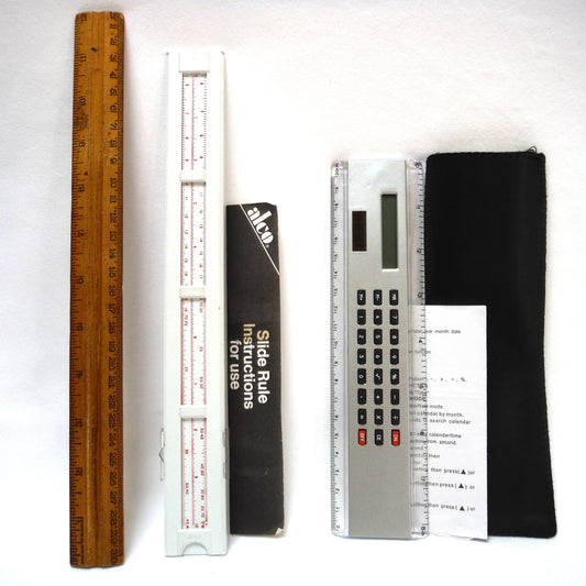 TRIO OF MEASURING DEVICES THROUGH THE AGES: Wood Ruler, Slide Ruler, and Electronic Ruler