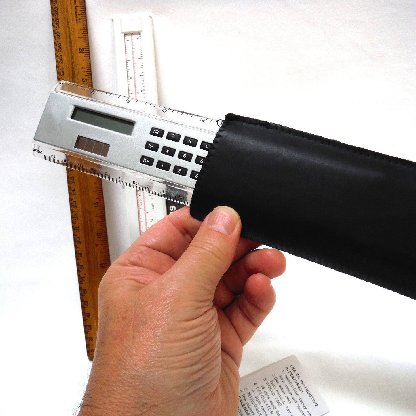 TRIO OF MEASURING DEVICES THROUGH THE AGES: Wood Ruler, Slide Ruler, and Electronic Ruler