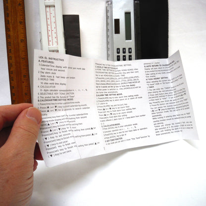 TRIO OF MEASURING DEVICES THROUGH THE AGES: Wood Ruler, Slide Ruler, and Electronic Ruler