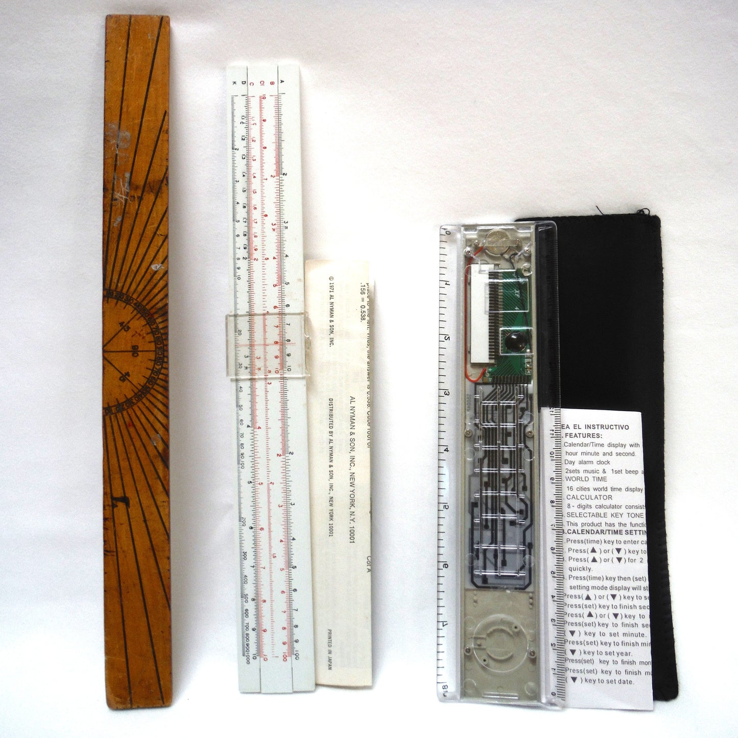 TRIO OF MEASURING DEVICES THROUGH THE AGES: Wood Ruler, Slide Ruler, and Electronic Ruler