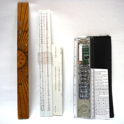 TRIO OF MEASURING DEVICES THROUGH THE AGES: Wood Ruler, Slide Ruler, and Electronic Ruler