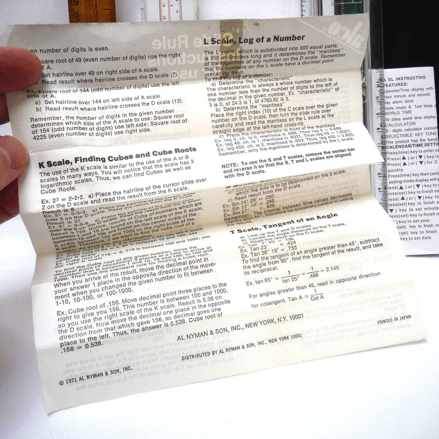 TRIO OF MEASURING DEVICES THROUGH THE AGES: Wood Ruler, Slide Ruler, and Electronic Ruler