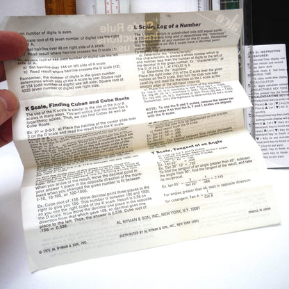TRIO OF MEASURING DEVICES THROUGH THE AGES: Wood Ruler, Slide Ruler, and Electronic Ruler