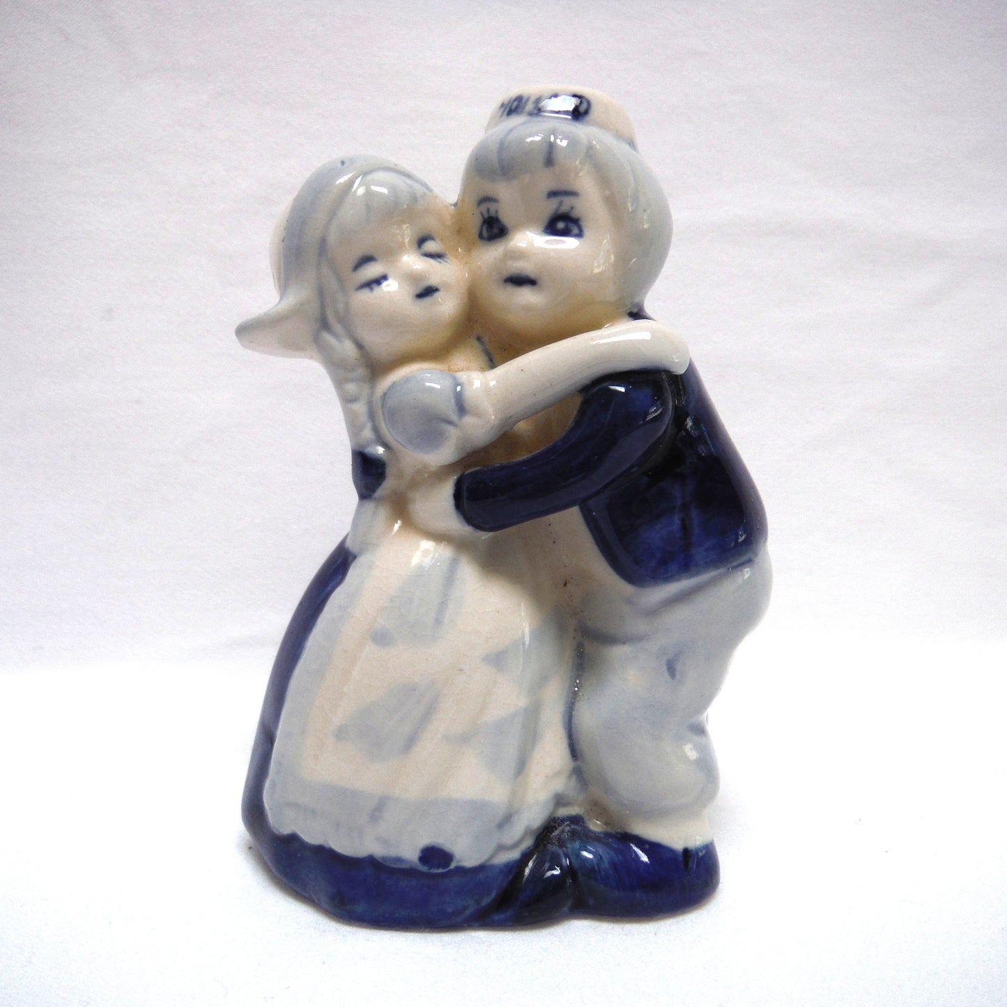 VINTAGE STATUE OF DUTCH COUPLE HUGGING OR DANCING, Hand Painted by DELFT BLUE