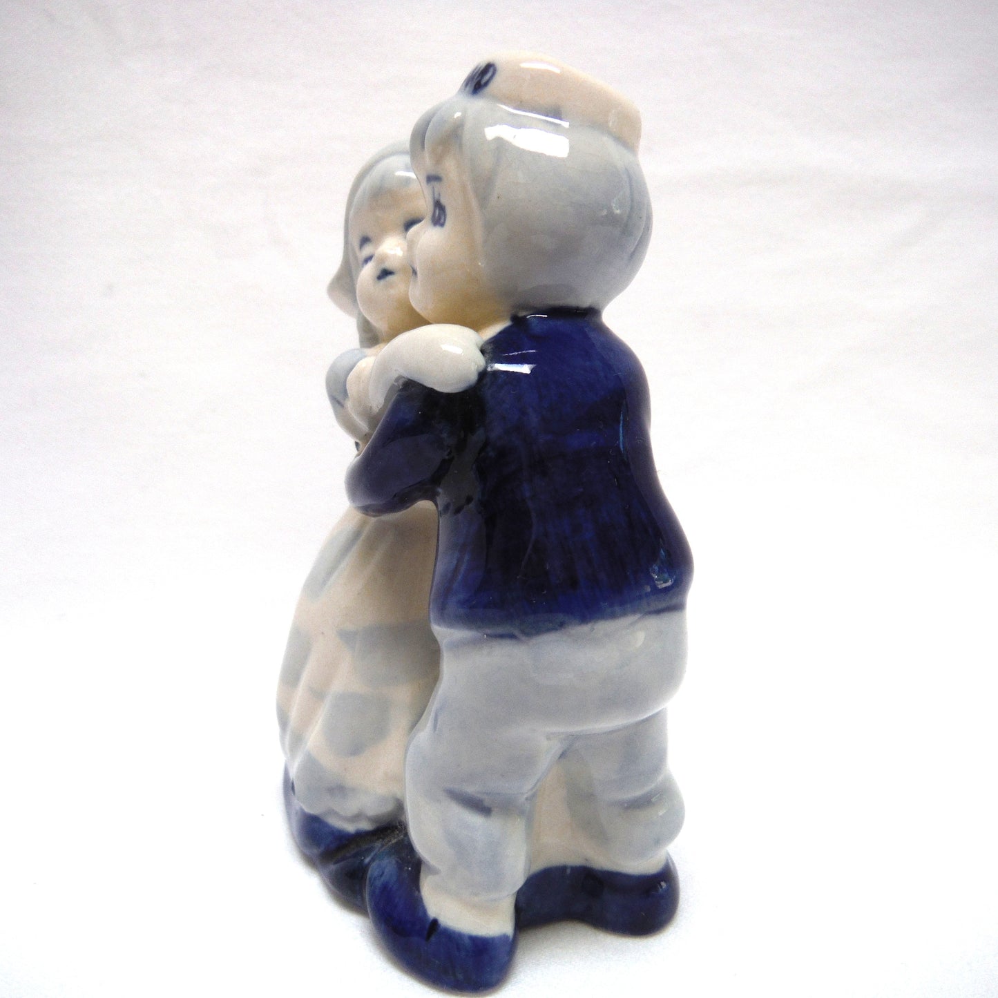 VINTAGE STATUE OF DUTCH COUPLE HUGGING OR DANCING, Hand Painted by DELFT BLUE