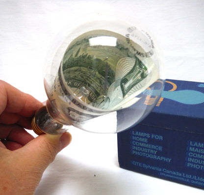 VINTAGE REAL $1 DOLLAR CANADIAN 1973 PAPER BANK NOTE INSIDE A SYLVANIA CLEAR LIGHT BULB!