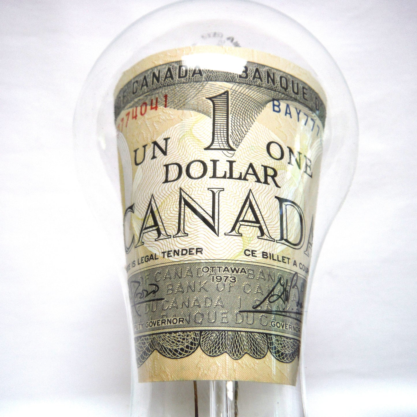 VINTAGE REAL $1 DOLLAR CANADIAN 1973 PAPER BANK NOTE INSIDE A SYLVANIA CLEAR LIGHT BULB!