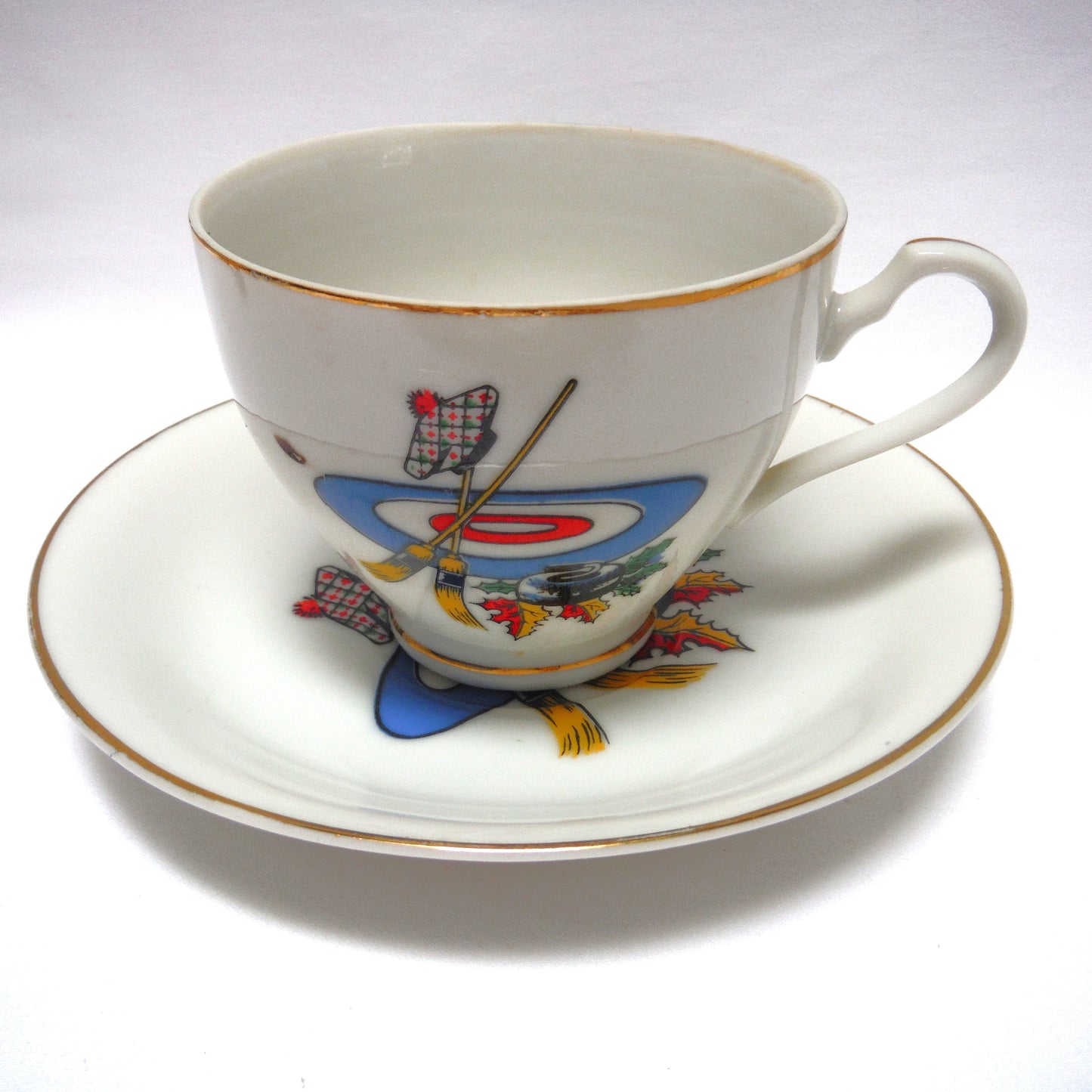 RARE VINTAGE CURLING MOTIF GOLD RIMMED TEA CUP & SAUCER, Designed in Canada, Made in Japan