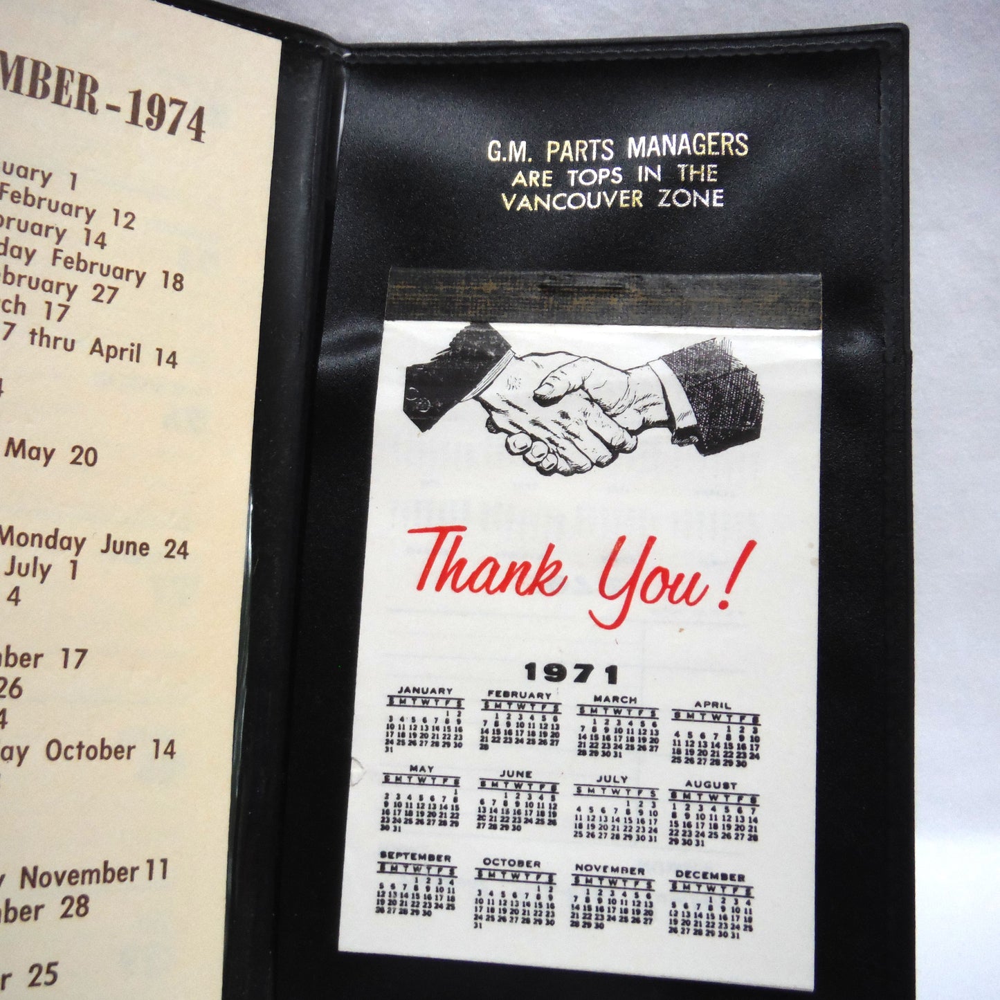 1970's Tri-Fold Black Vinyl Automotive Pocket Calendar: 'GM PARTS MANAGERS ARE TOPS IN THE VANCOUVER ZONE'