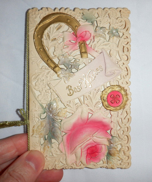 'BEST WISHES' An Antique Christmas Card uniquely and intricately-cut and hand-coloured, 1910's