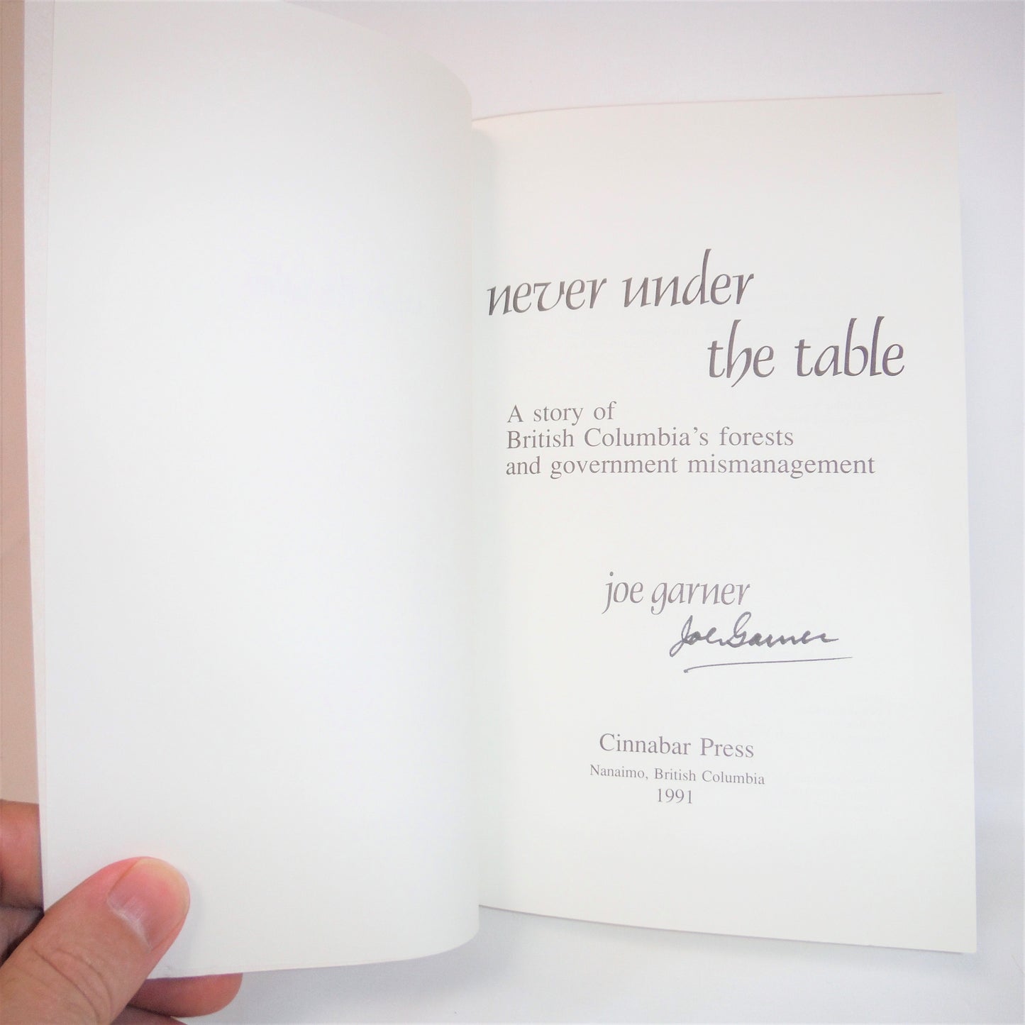 NEVER UNDER THE TABLE, by Joe Garner (1992-SIGNED)