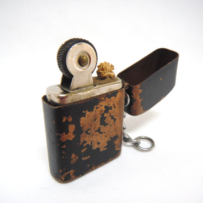 Antique Cigarette Lighter and A Yellow Asian-Style Silk Bag