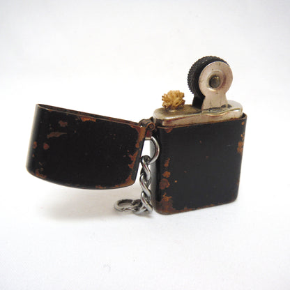 Antique Cigarette Lighter and A Yellow Asian-Style Silk Bag