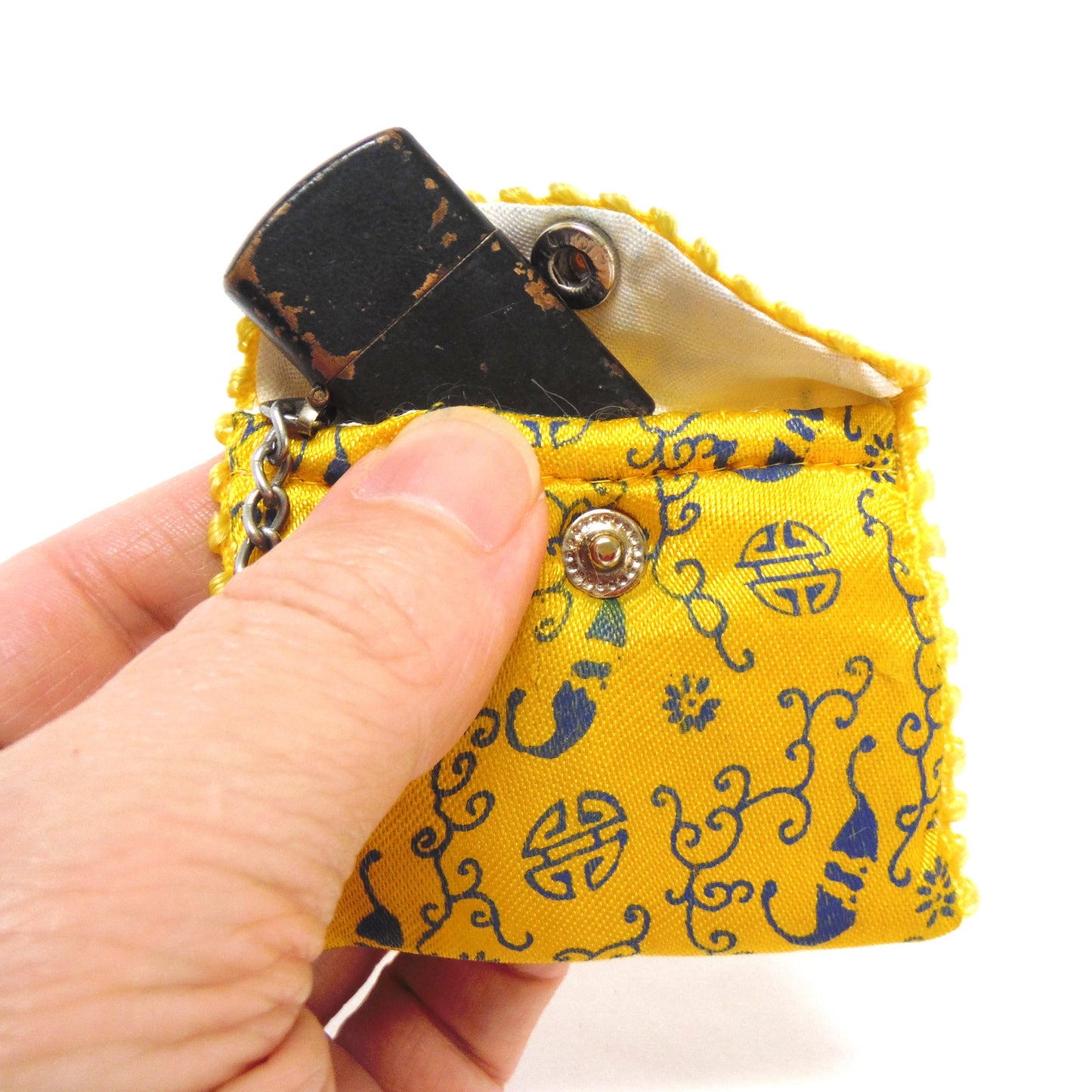 Antique Cigarette Lighter and A Yellow Asian-Style Silk Bag