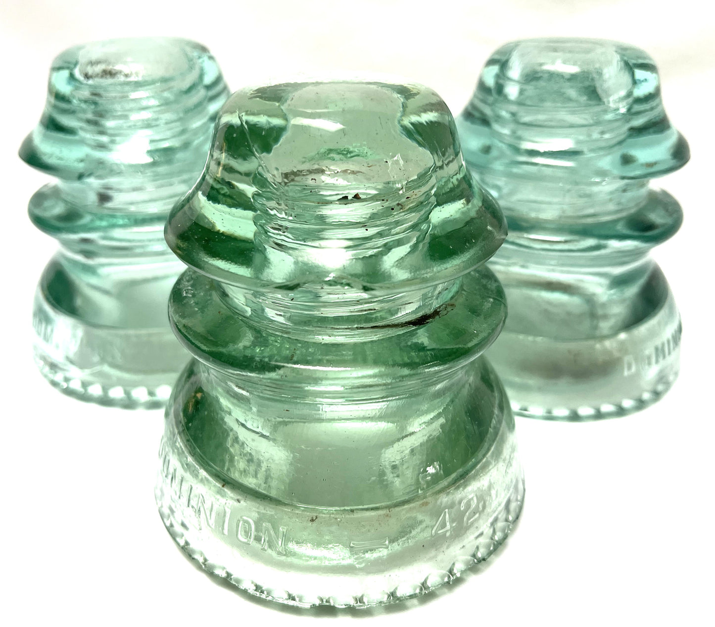 GLASS TELEGRAPH INSULATOR #42D, Made by DOMINION GLASS of CANADA in Misty Green Colour (SLIGHT DAMAGE-CHIPPED!)
