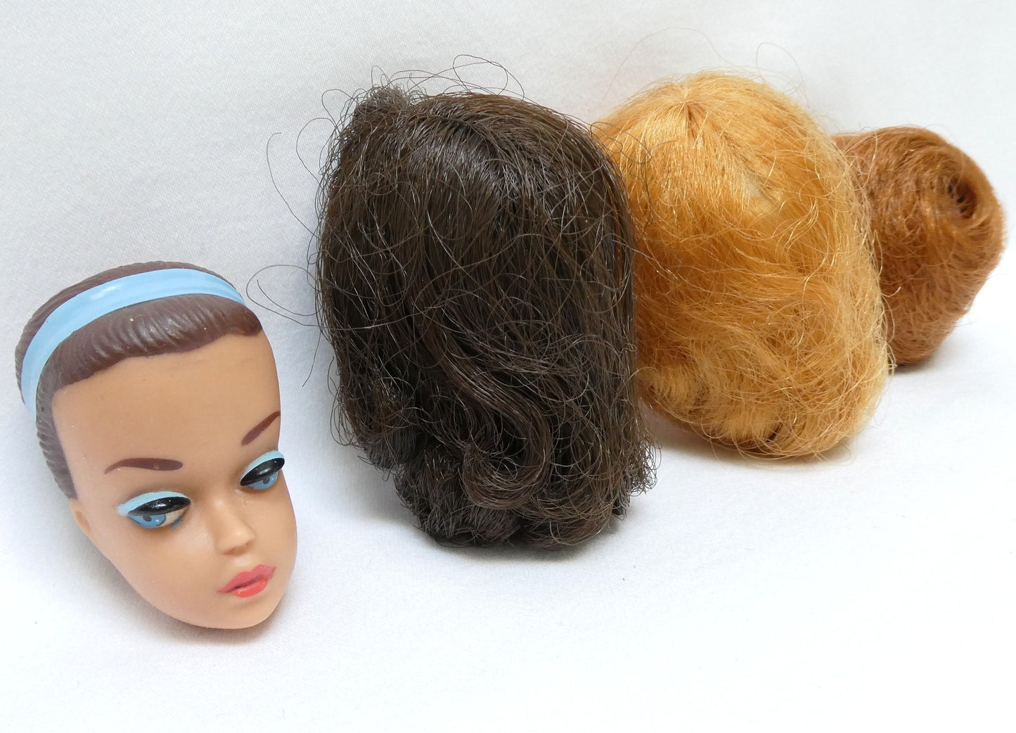 Vintage Original 1963 'Fashion Queen' BARBIE HEAD ONLY, Featuring the iconic blue headband and molded brown hair...PLUS 3 BONUS WIGS!