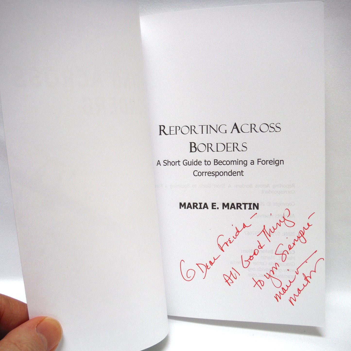 REPORTING ACROSS BORDERS, A Short Guide to Becoming a Foreign Correspondent, by Maria E. Martin (1st Ed. SIGNED)