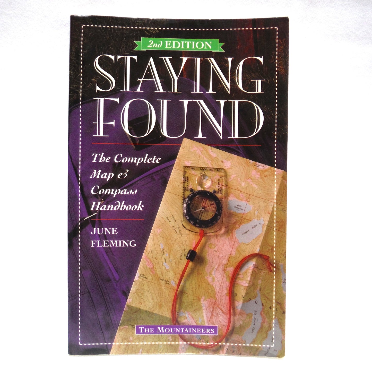 STAYING FOUND, The Complete Map & Compass Handbook by The Mountaineers, and June Fleming, (1997 2nd. Ed.)