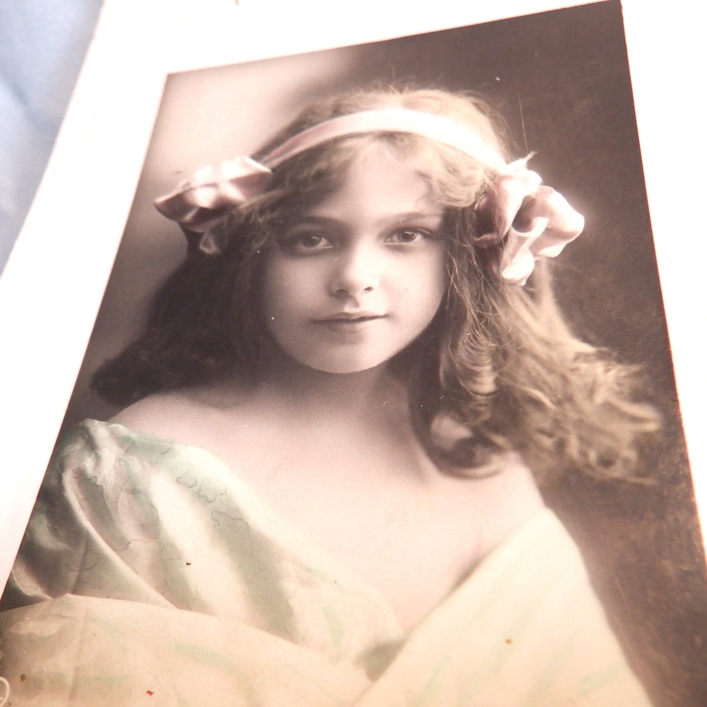 Antique Hand-Tinted German Postcard from 1910, Featuring "THE GIRL WITH A PINK BOW IN HER HAIR"