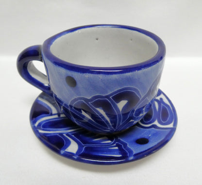 Hand-painted blue and white ceramic espresso cup and saucer set featuring traditional Mexican Talavera-style floral patterns