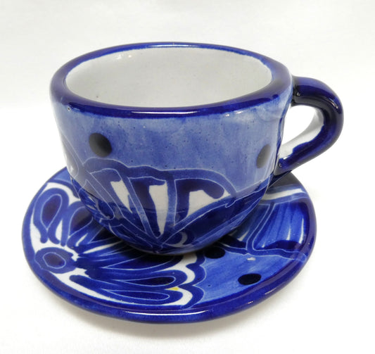 Hand-painted blue and white ceramic espresso cup and saucer set featuring traditional Mexican Talavera-style floral patterns
