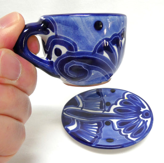Hand-painted blue and white ceramic espresso cup and saucer set featuring traditional Mexican Talavera-style floral patterns