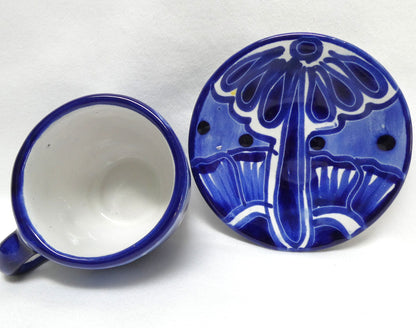 Hand-painted blue and white ceramic espresso cup and saucer set featuring traditional Mexican Talavera-style floral patterns
