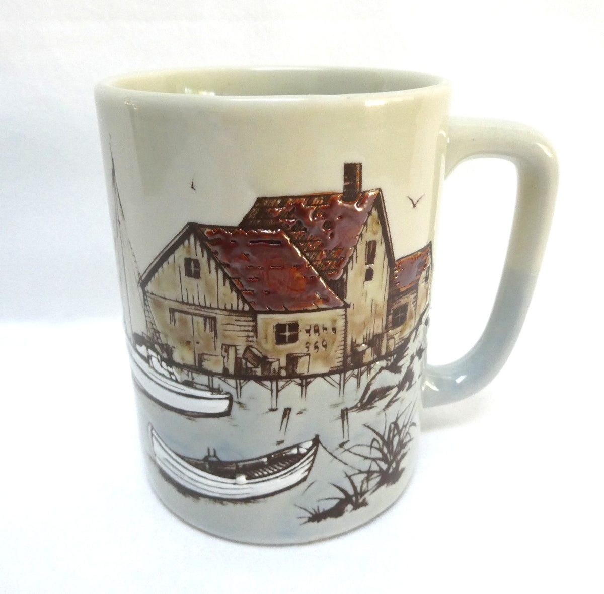 Otagiri Japanese Stoneware Coffee Mug Featuring an Embossed and Hand-Painted Canadian Maritime Coastal Fishing Village and Boat Scene