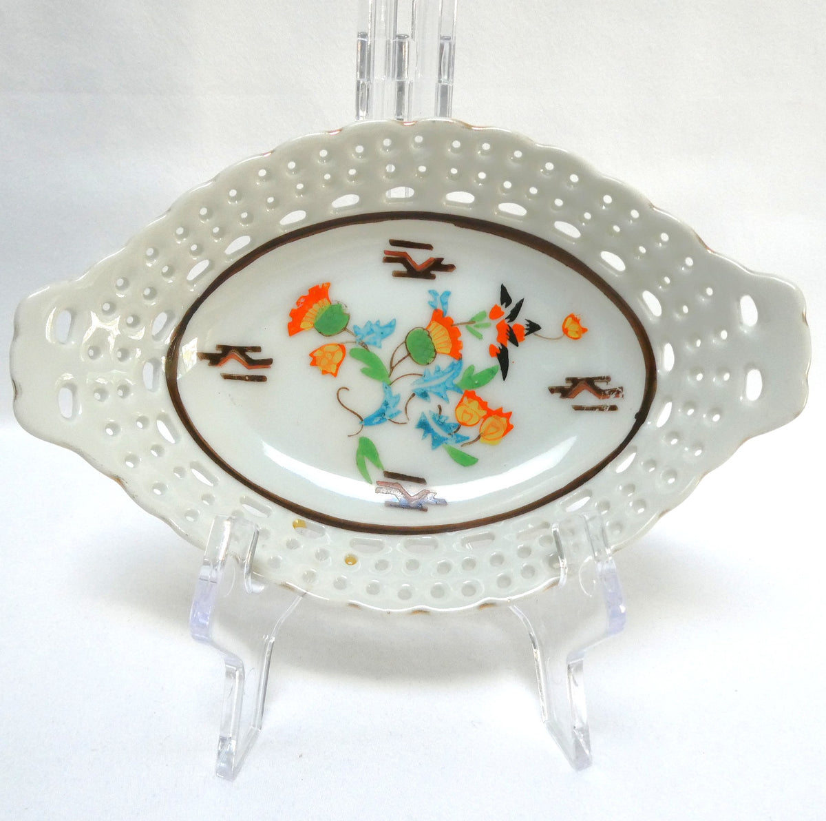 Vintage reticulated porcelain trinket dish featuring a delicate, pierced lattice rim and integrated small handles from Japan