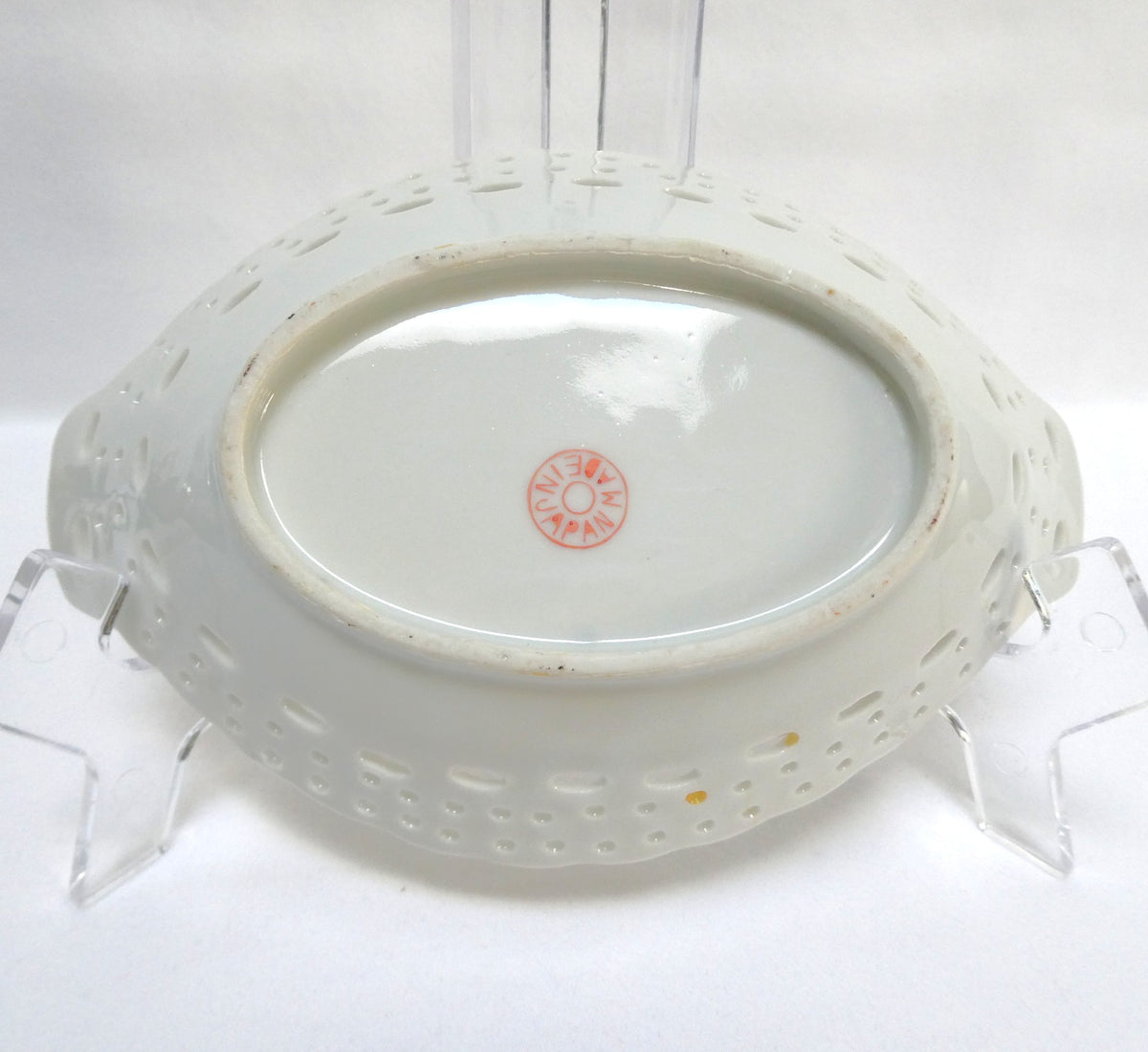 Vintage reticulated porcelain trinket dish featuring a delicate, pierced lattice rim and integrated small handles from Japan
