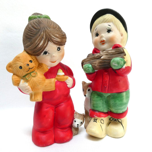 Pair of Vintage 1970's 'Sugarplum' Christmas Holiday Porcelain Pomander Figurines: Featuring Girl in Red PJ's and Boy Carrying Wood
