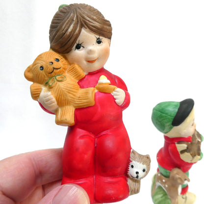 Pair of Vintage 1970's 'Sugarplum' Christmas Holiday Porcelain Pomander Figurines: Featuring Girl in Red PJ's and Boy Carrying Wood