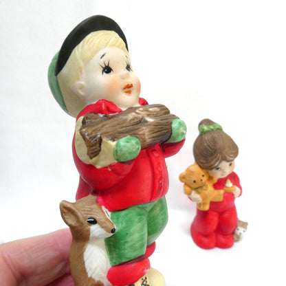 Pair of Vintage 1970's 'Sugarplum' Christmas Holiday Porcelain Pomander Figurines: Featuring Girl in Red PJ's and Boy Carrying Wood
