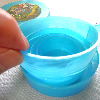 Vintage Portable Collapsing Travel Mug in Turquoise Blue: ROYAL CANADIAN MOUNTED POLICE, by "Collaps-A-Mug" of Hong Kong