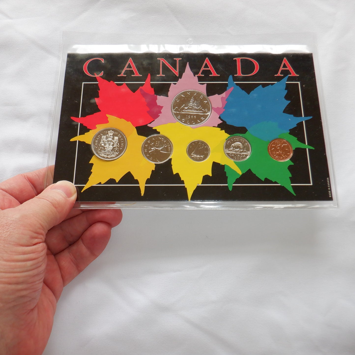 1986 CANADIAN 6-COIN SPECIMEN SET, on 6-colour CANADA C.C.A & S. DISPLAY BOARD